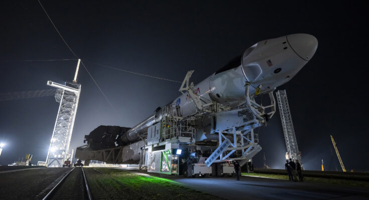 SpaceX rocket rolling to the launch pad on a transport truck.