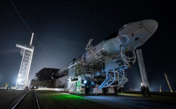 A night photo of the SpaceX Falcon 9 being transported