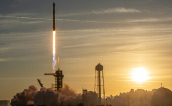a rocket launches into a sunset sky