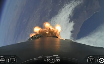 view from the top of a rocket looking down at a curve of coastline, with the blackness of space visible in the background