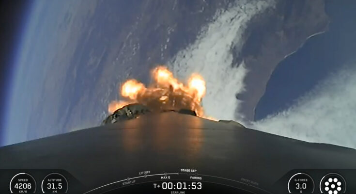view from the top of a rocket looking down at a curve of coastline, with the blackness of space visible in the background