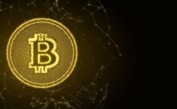 Bitcoin logo on gold token.