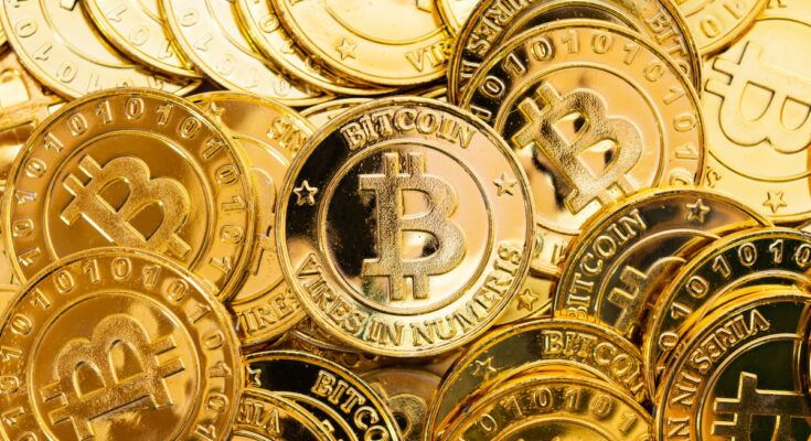 Pile of gold Bitcoins.
