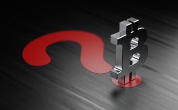 A silver Bitcoin-logo figurine on a large red question mark.