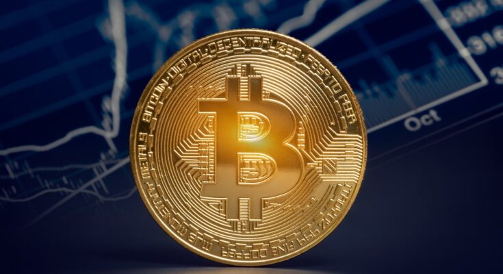 Gold coin with Bitcoin logo.