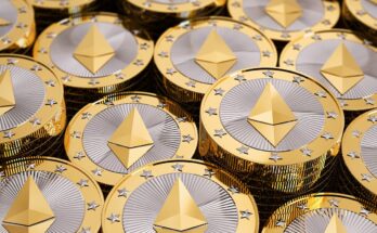 A pile of coins lay together embossed with the Ethereum logo.