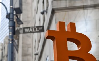 Orange Bitcoin symbol on Wall Street.