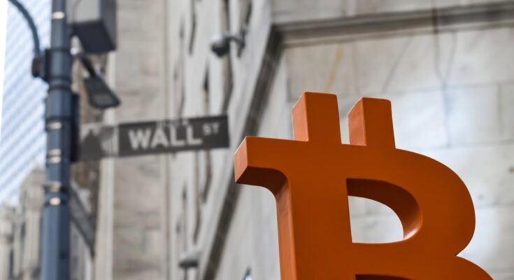 Orange Bitcoin symbol on Wall Street.