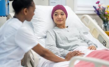 Doctor and patient in a hospital room.