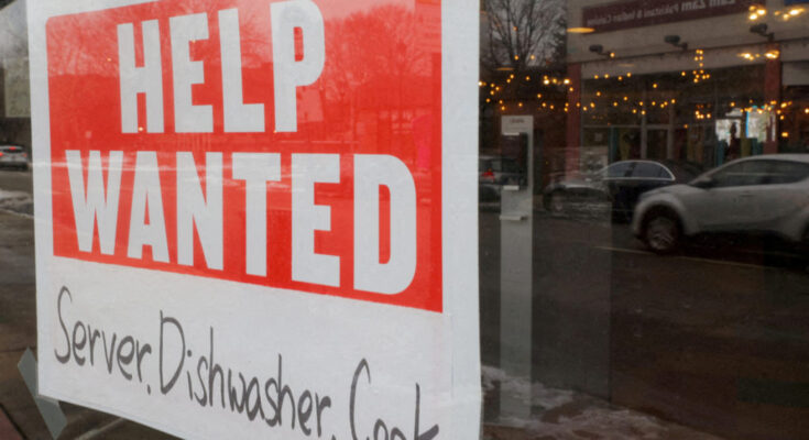 FILE PHOTO: A “Help Wanted” sign hangs in restaurant window in Medford